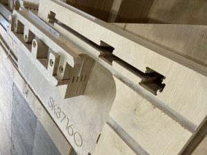 Stack of various birch plywood CNC machined components