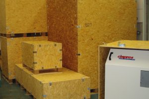 A selection of OSB export crates ready to ship injection moulding equipment