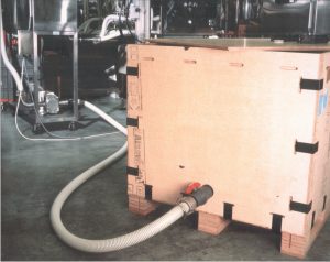 Crocodile liquid IBC in Bodyshop production facility with hose attached