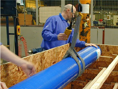 Roll of specialist flooring being lowered into Crocodile shipping crate