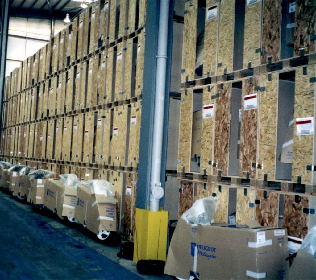 large wooden crates used for storage, stacked 4 boxes high