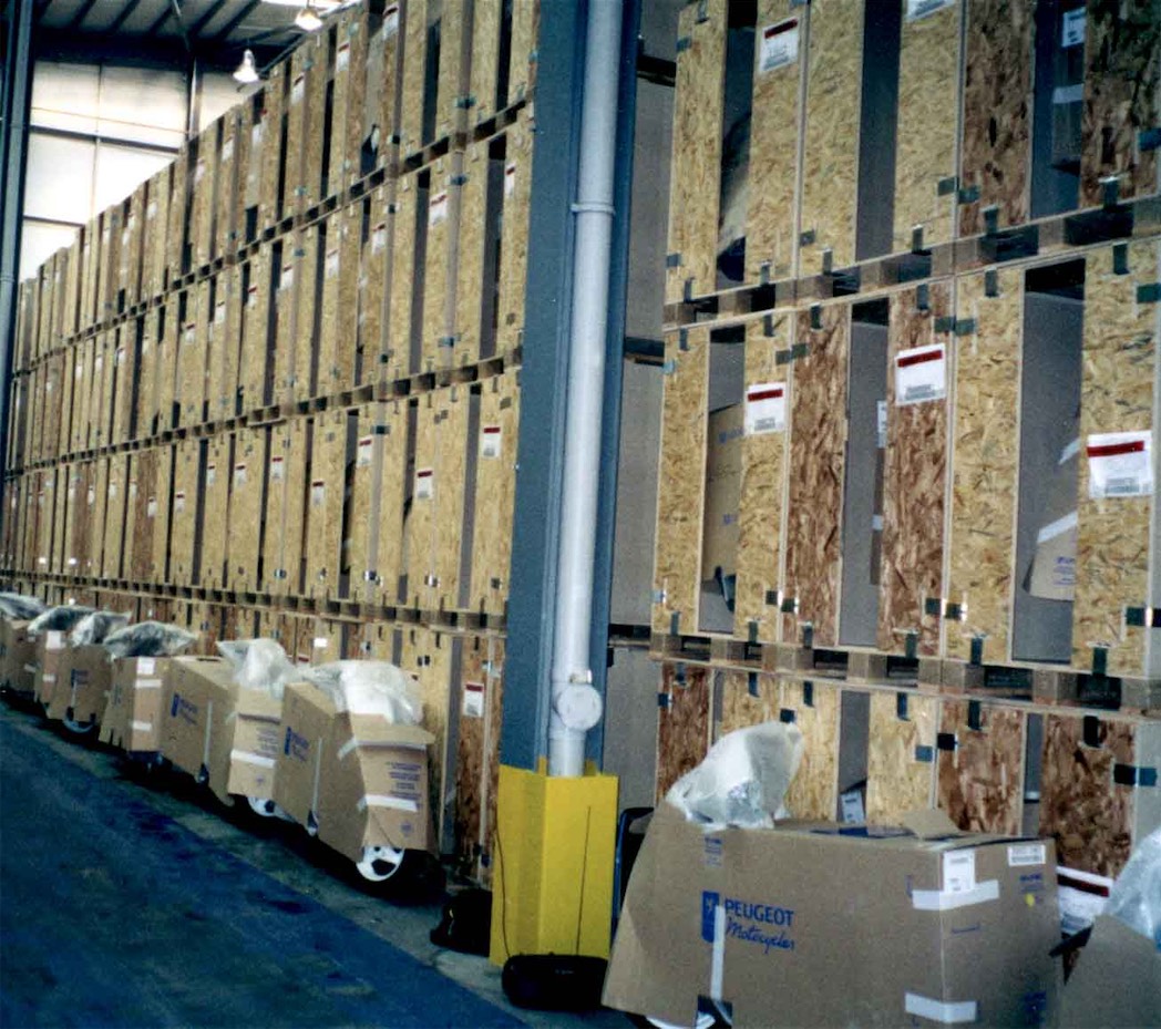 large wooden crates used for storage, stacked 4 boxes high